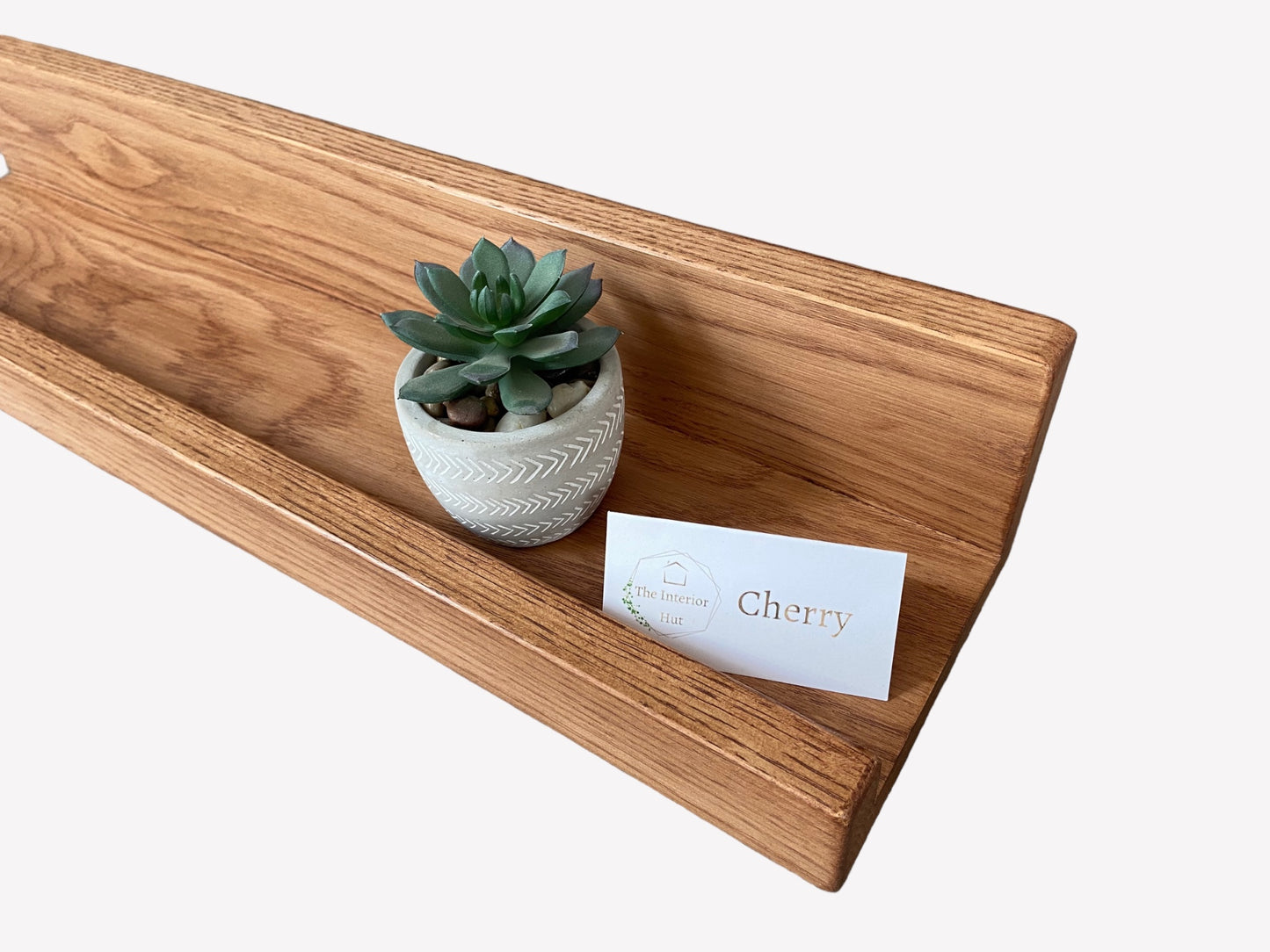 Handmade oak picture shelf with a smooth Cherry wax finish