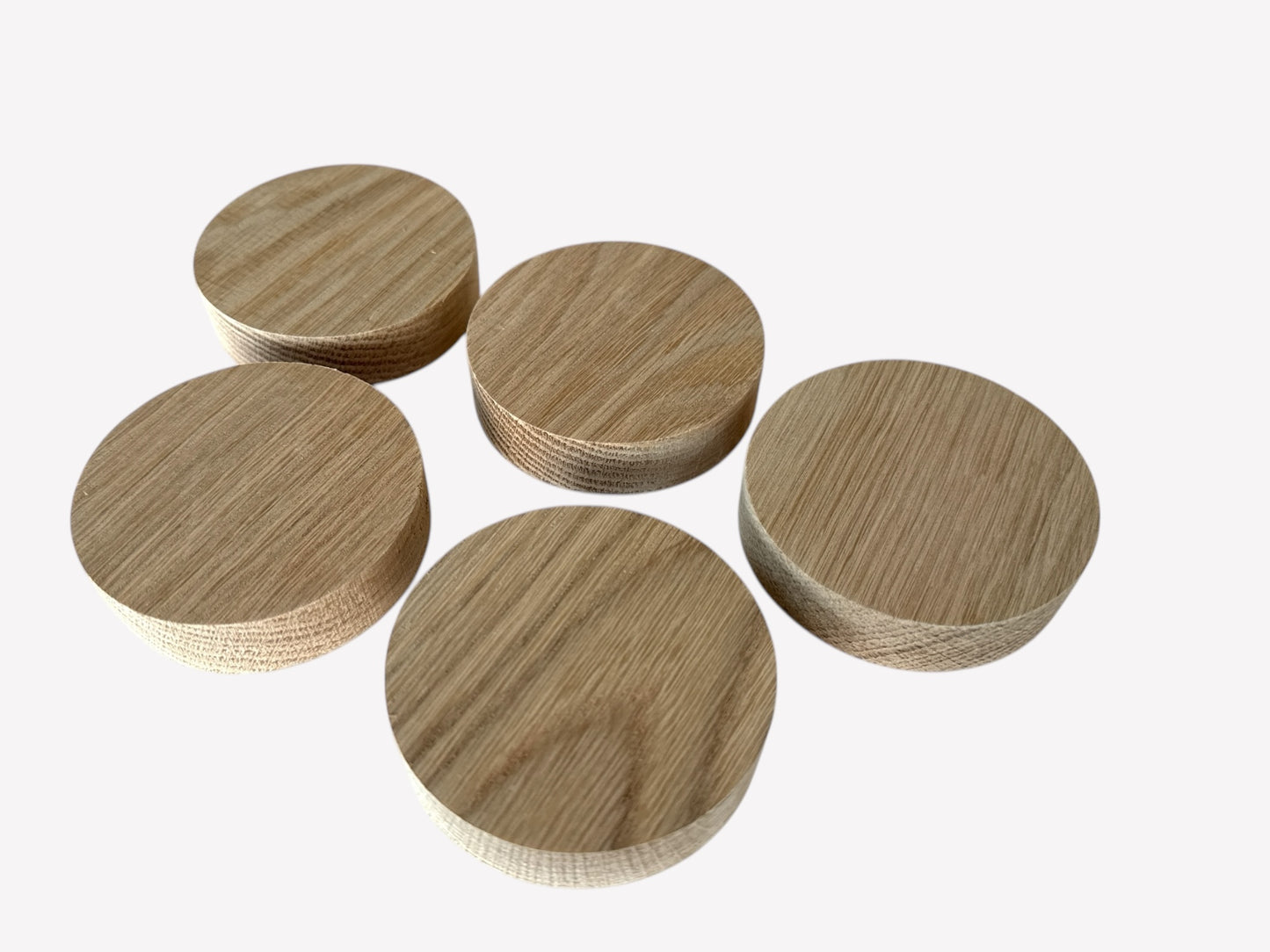 Five matching solid oak wood circle blanks, perfect for crafting and engraving