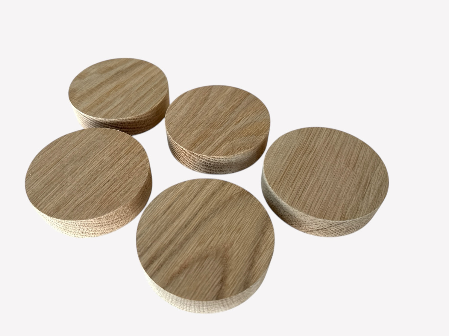 Five matching solid oak wood circle blanks, perfect for crafting and engraving