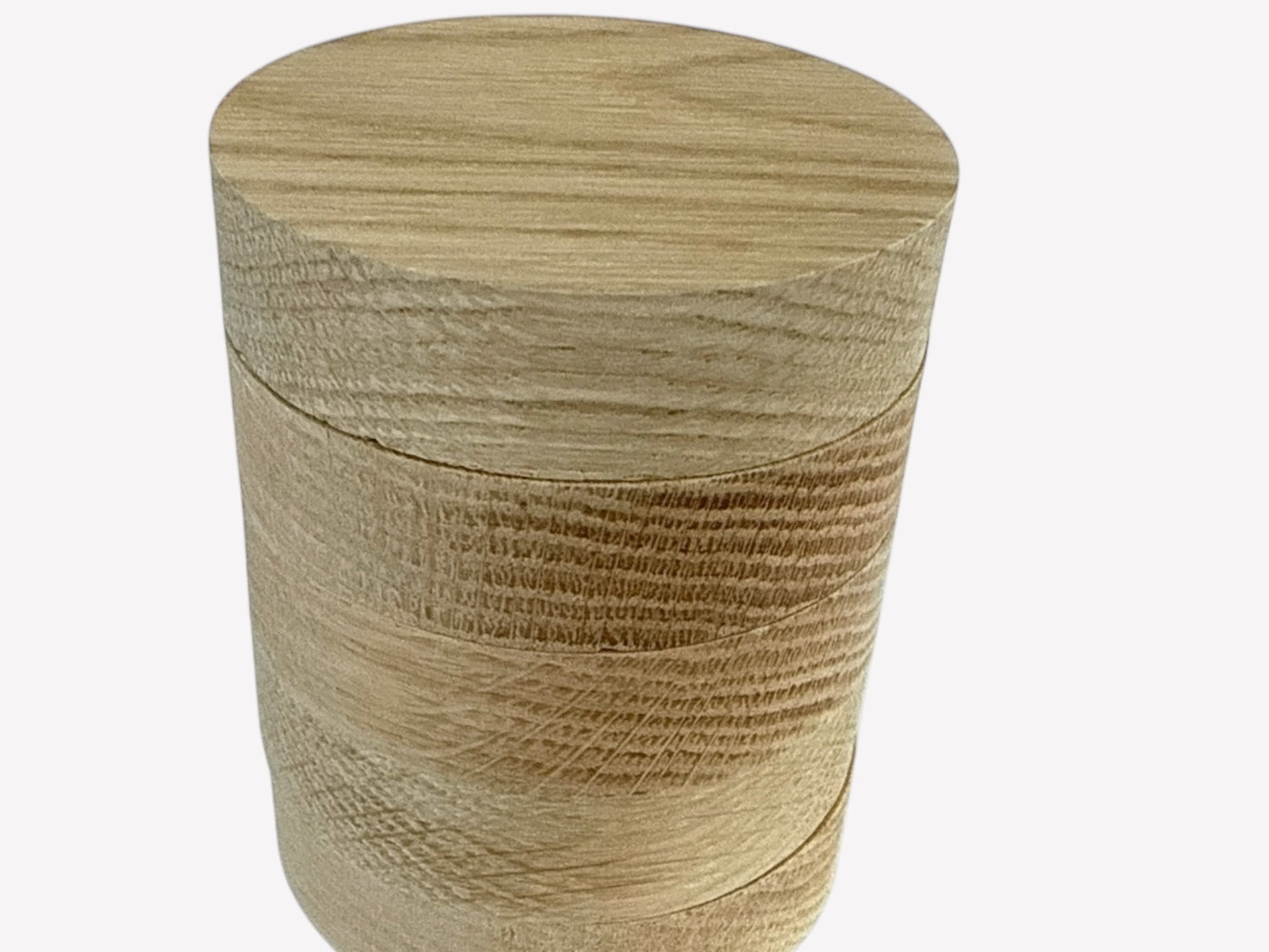 Five identical round oak wood blanks with natural oak grain, suitable for crafts and home décor projects, stacked on top f each other.