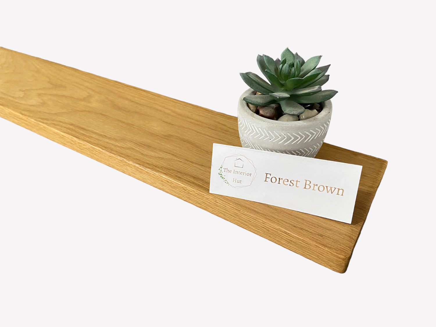 Slim oak floating shelf showing a Forest Brown wax finish option